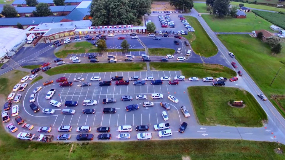 image from the air of very long carpool line at school