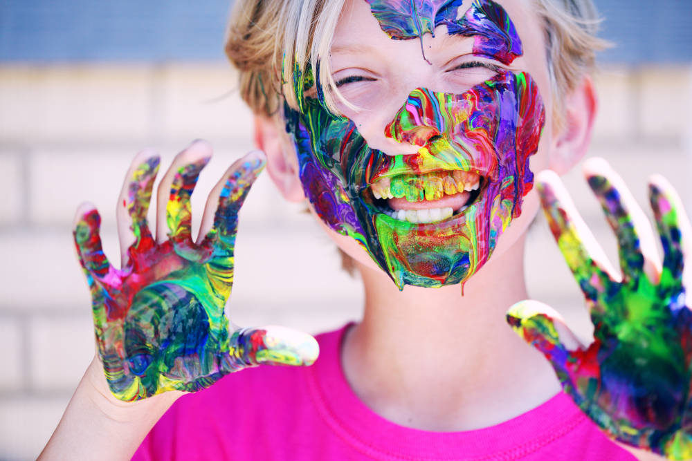 child with paint on face